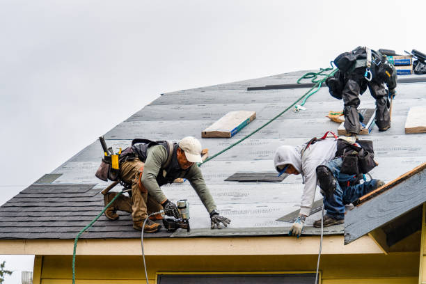 Professional Roofing technician working in Eastport, NY